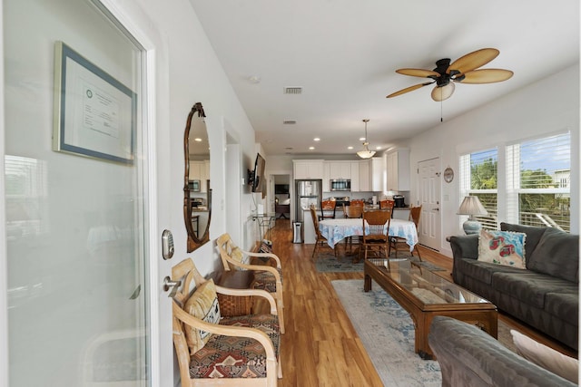 31 W 9th St, Folly Beach, SC 29439 - living room with wood finished floors, ceiling fan, and recessed lighting
