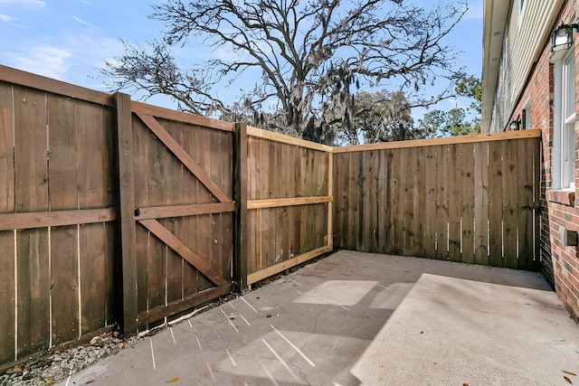 view of patio / terrace featuring fence