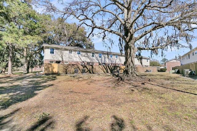 back of property with central AC