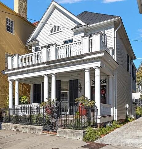 view of front facade with a balcony and a porch