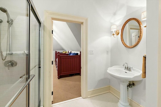 bathroom with tile patterned floors and an enclosed shower