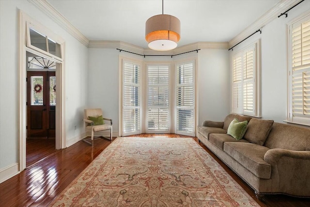 living room with dark hardwood / wood-style flooring and crown molding