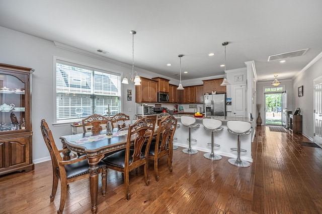5442 Clearview Dr, North Charleston, SC 29420 - dining space with ornamental molding, dark wood finished floors, recessed lighting, and baseboards