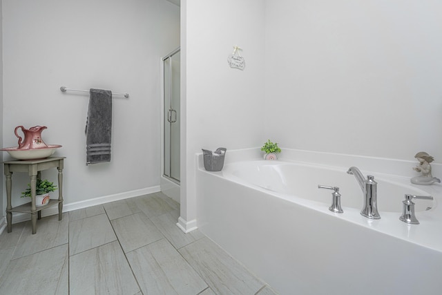 5442 Clearview Dr, North Charleston, SC 29420 - full bath featuring a bath, a shower with door, and baseboards