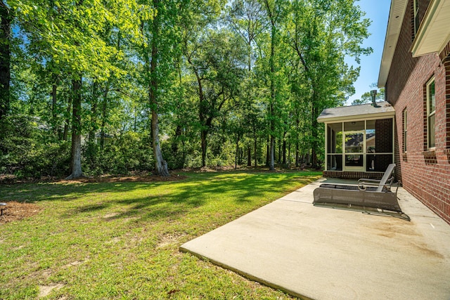 5442 Clearview Dr, North Charleston, SC 29420 - view of grassy yard with a sunroom and a patio