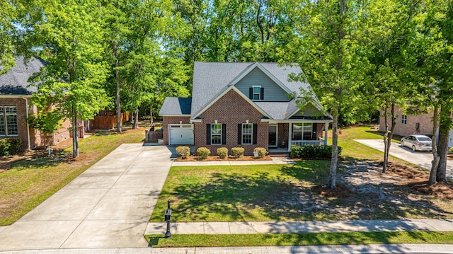 5442 Clearview Dr, North Charleston, SC 29420 - traditional-style home with a porch, driveway, a front lawn, brick siding, and an attached garage