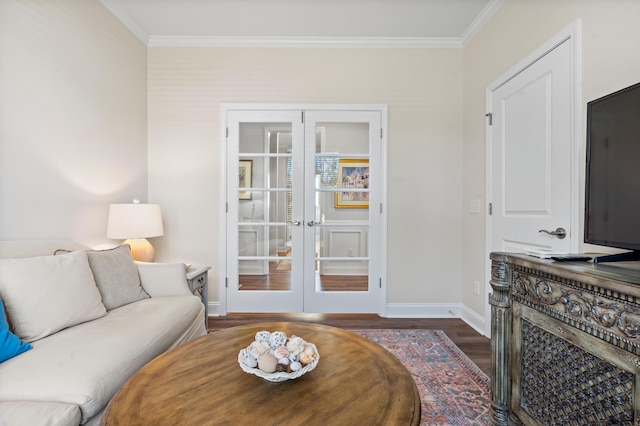 living room featuring crown molding, dark hardwood / wood-style floors, and french doors