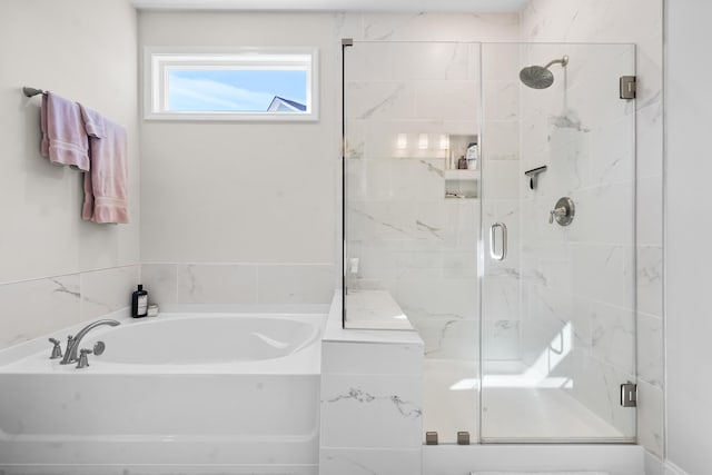 bathroom with shower with separate bathtub