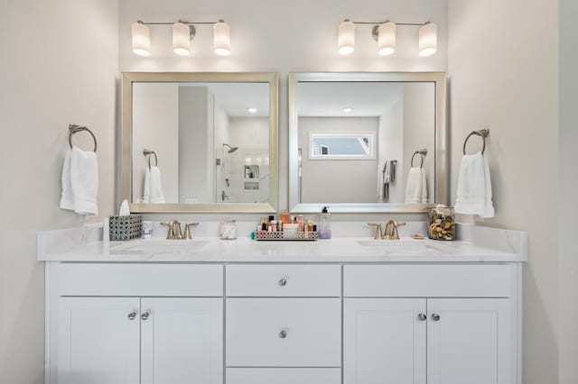 bathroom featuring vanity and a shower with shower door