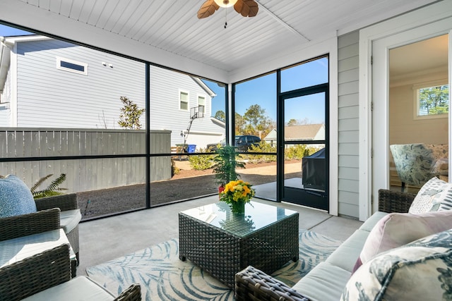 sunroom featuring ceiling fan