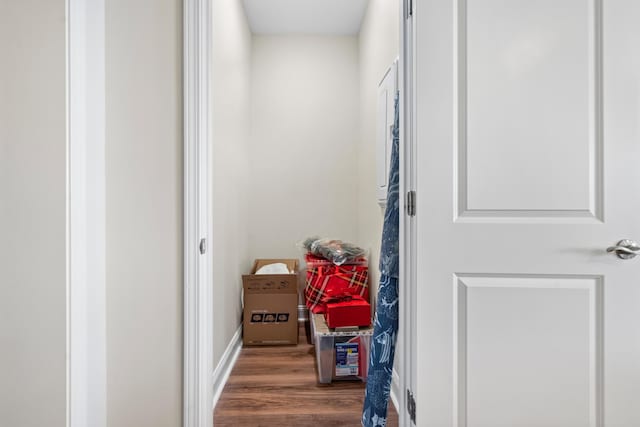 corridor featuring dark hardwood / wood-style flooring