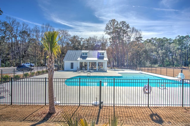 view of swimming pool featuring a patio