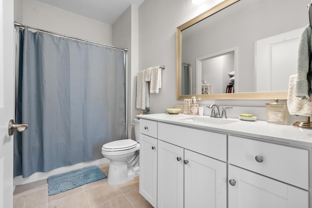 bathroom with vanity, toilet, and tile patterned flooring