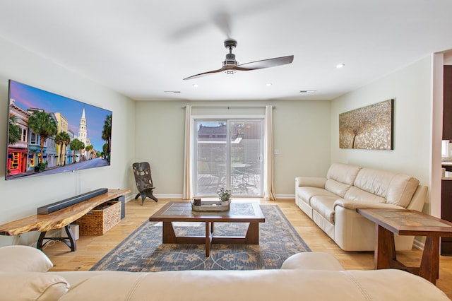 living room featuring ceiling fan, recessed lighting, light wood-type flooring, and baseboards