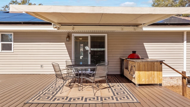 wooden deck with outdoor dining area