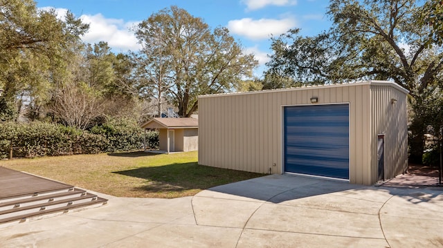 detached garage featuring driveway