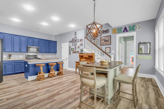 dining space with stairs, light wood-style floors, baseboards, recessed lighting, and a chandelier