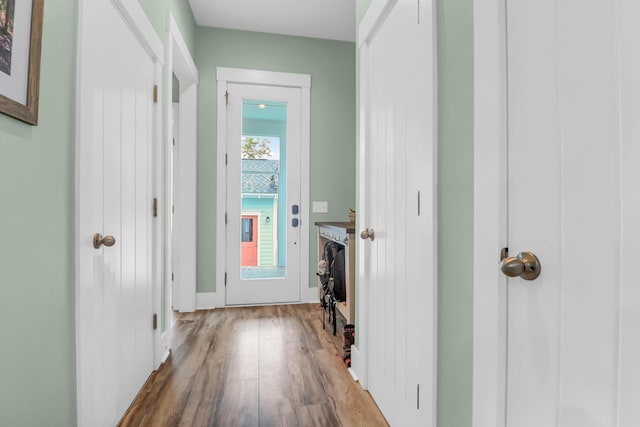 doorway to outside featuring wood finished floors