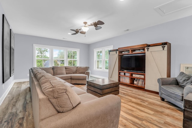 living room featuring a ceiling fan, wood finished floors, recessed lighting, and baseboards