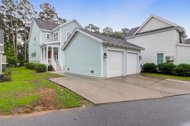 view of side of property with an attached garage, concrete driveway, and a shingled roof