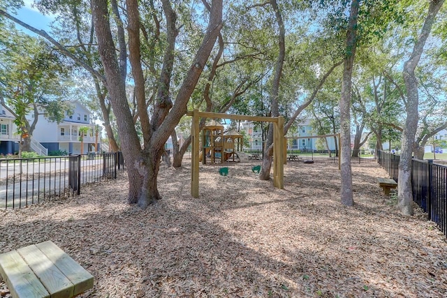 view of yard featuring fence and a residential view
