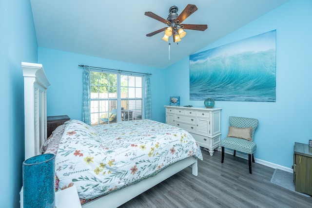 bedroom with lofted ceiling, wood finished floors, baseboards, and ceiling fan