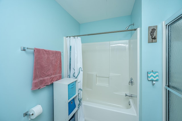 bathroom featuring shower / bath combo with shower curtain