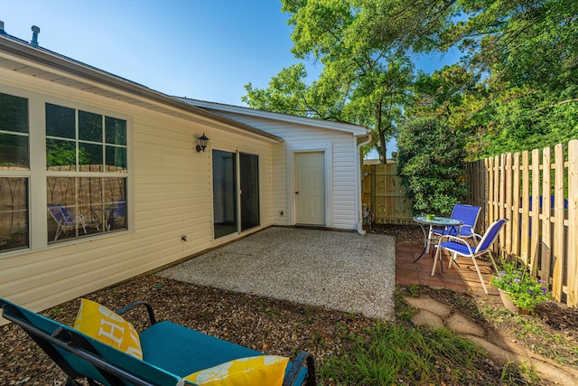 view of patio featuring fence