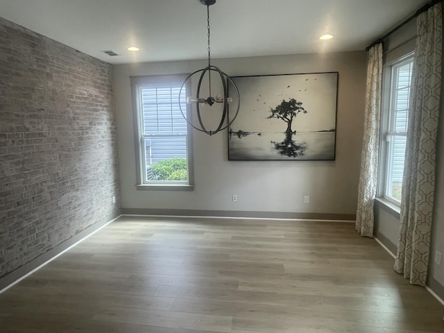 118 Magnolia House Dr, Summerville, SC 29486 - unfurnished dining area with wood finished floors, brick wall, and baseboards
