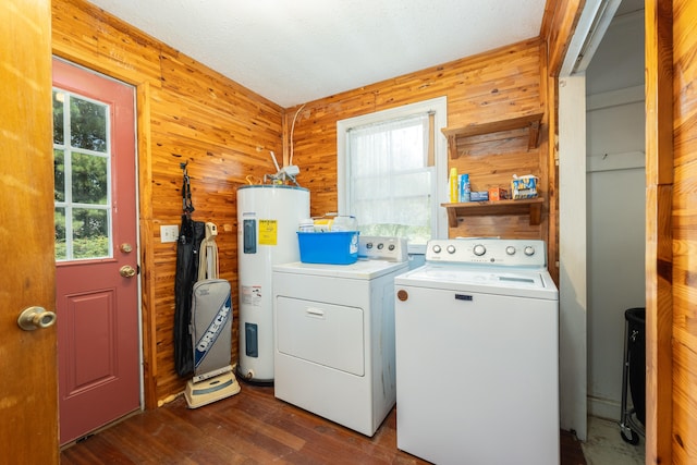 laundry area with independent washer and dryer, wooden walls, hardwood / wood-style floors, and electric water heater