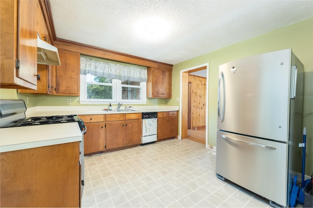 kitchen featuring sink, white appliances, light tile patterned floors, and wall chimney exhaust hood