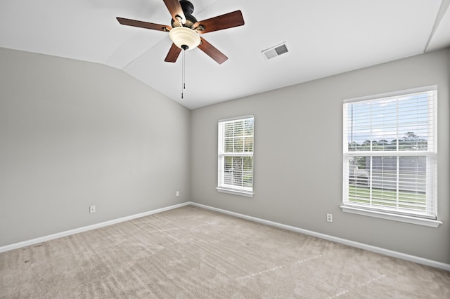 unfurnished room with ceiling fan, light colored carpet, and vaulted ceiling