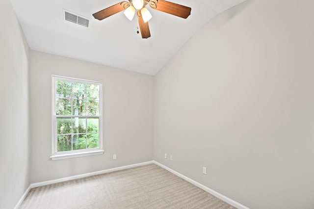 unfurnished room with lofted ceiling, light colored carpet, and ceiling fan