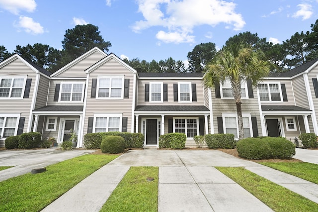 view of property featuring a front yard