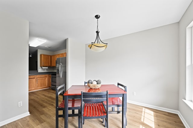 dining space featuring hardwood / wood-style floors