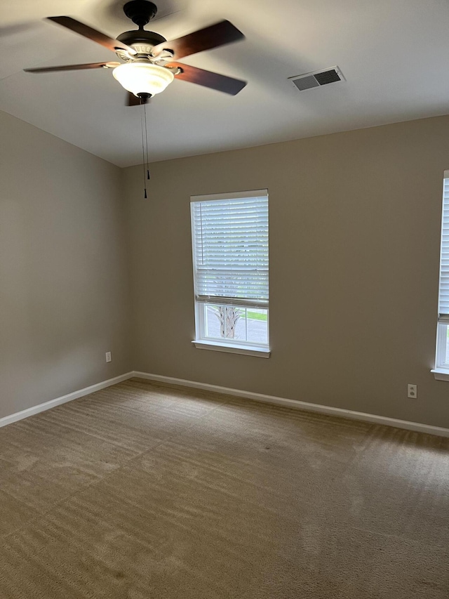 carpeted empty room with ceiling fan