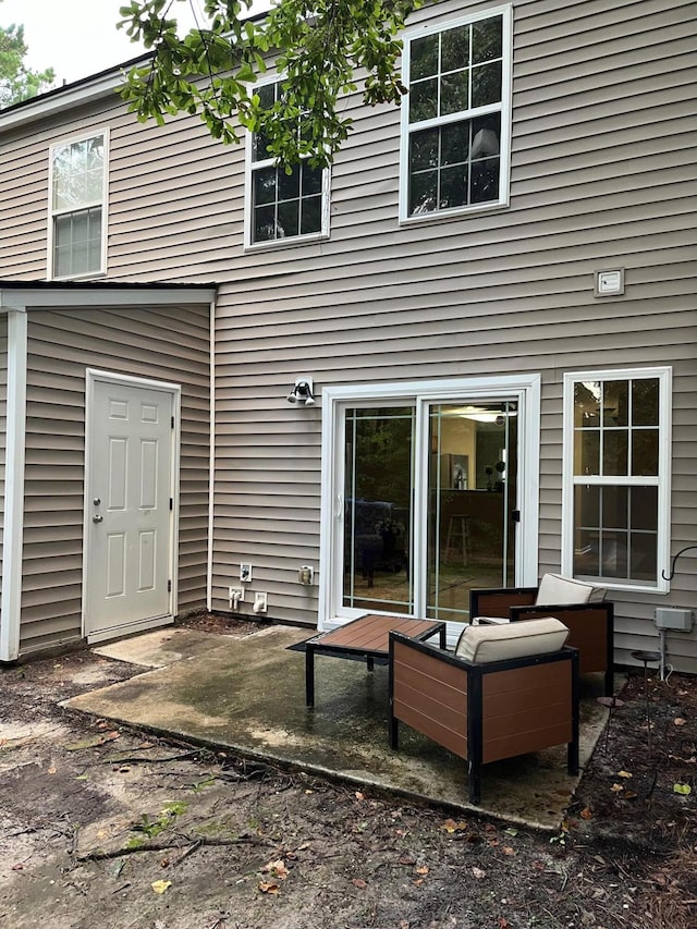 back of house with a patio area