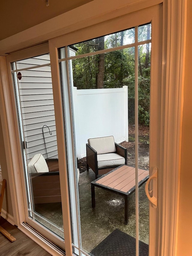 doorway to outside with hardwood / wood-style flooring