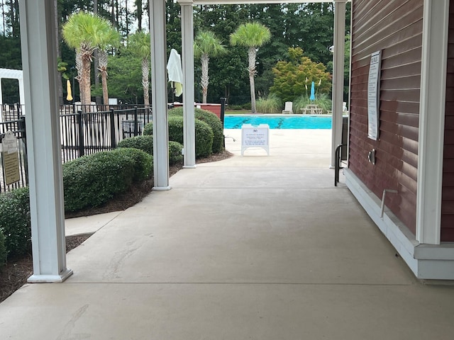 view of patio / terrace featuring a community pool