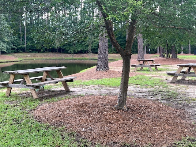 surrounding community featuring a water view