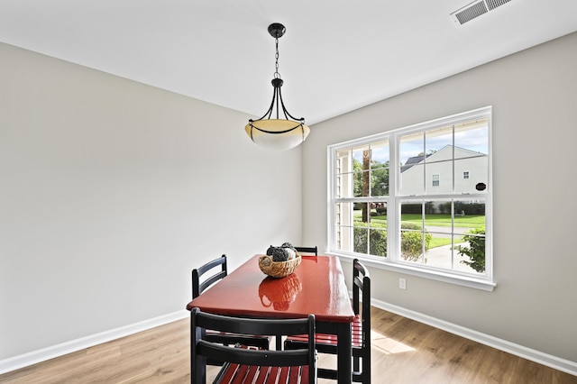 dining space featuring a healthy amount of sunlight and light hardwood / wood-style floors