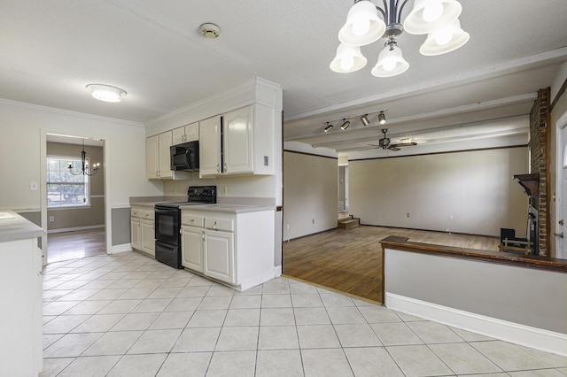 kitchen with black appliances, ceiling fan with notable chandelier, white cabinets, ornamental molding, and light tile patterned floors