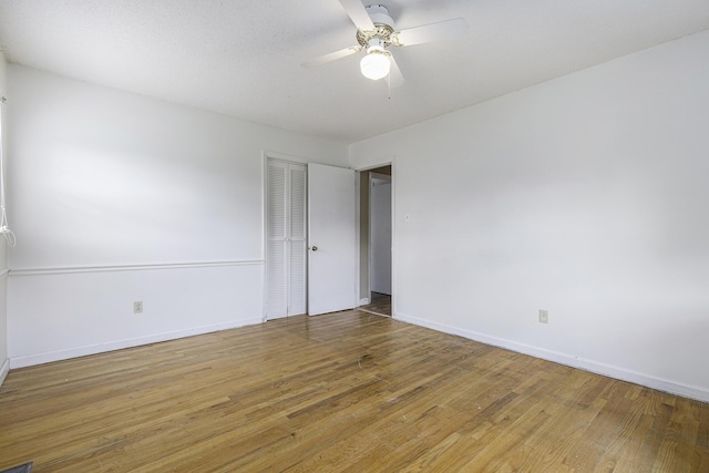 spare room with ceiling fan and hardwood / wood-style floors