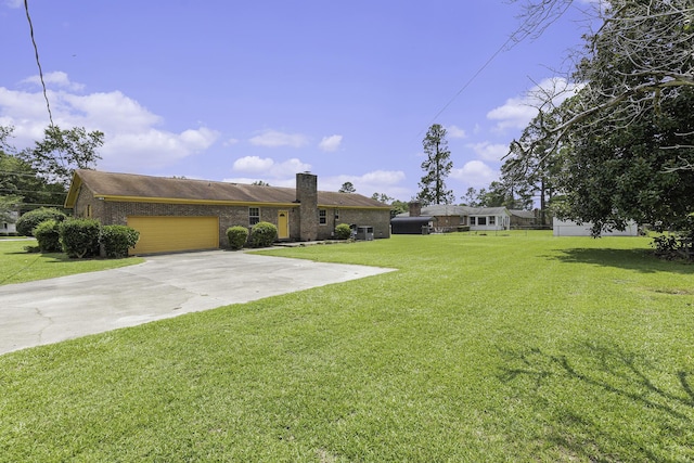 exterior space featuring a front yard and a garage