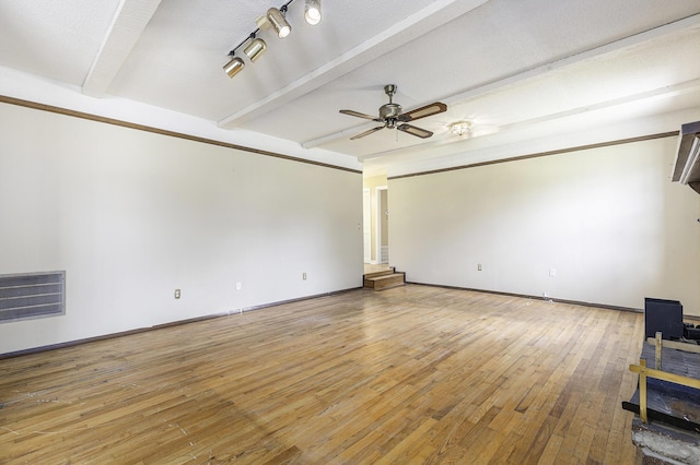 unfurnished living room featuring ceiling fan, beamed ceiling, and wood-type flooring