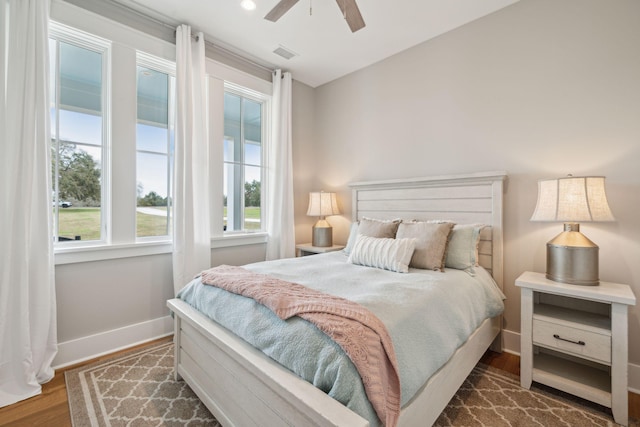 bedroom with ceiling fan, recessed lighting, visible vents, baseboards, and dark wood-style floors