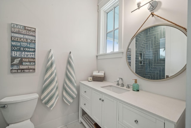 bathroom with toilet and vanity