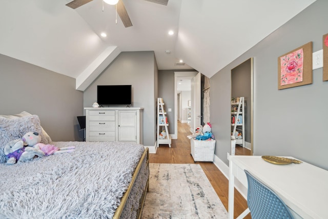 bedroom with recessed lighting, vaulted ceiling, light wood-style flooring, and baseboards