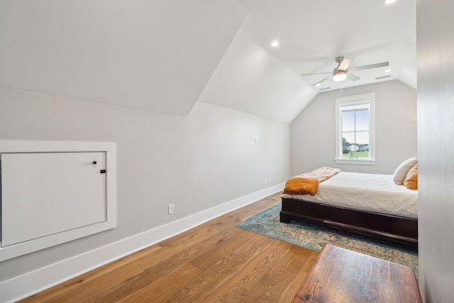 bedroom with recessed lighting, ceiling fan, vaulted ceiling, wood finished floors, and baseboards