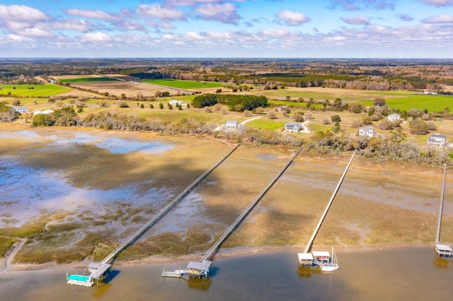 drone / aerial view featuring a rural view and a water view